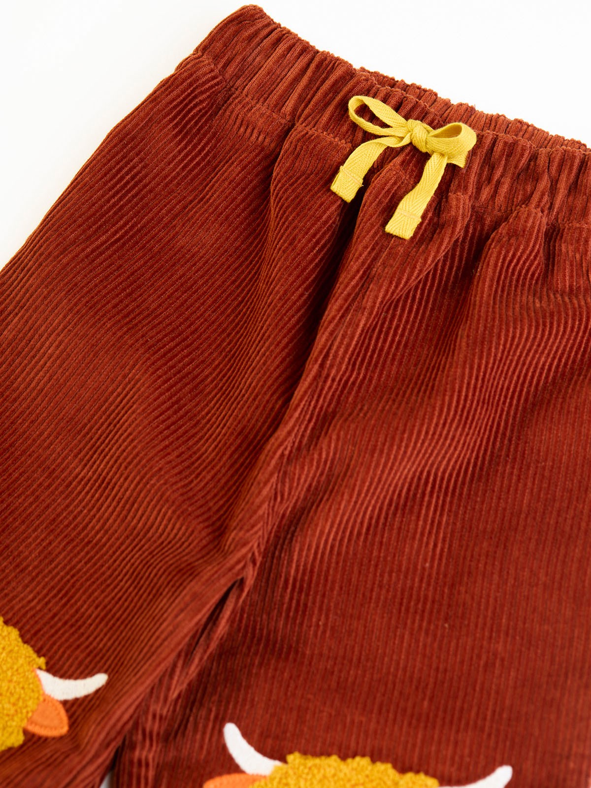 FRUGI ARLO CORD TROUSERS in CHOCOLATE BROWN WITH HIGHLAND COW KNEE PATCHES